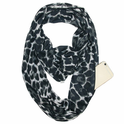 Leopard print infinity scarf, black and gray with red accents, draped loop