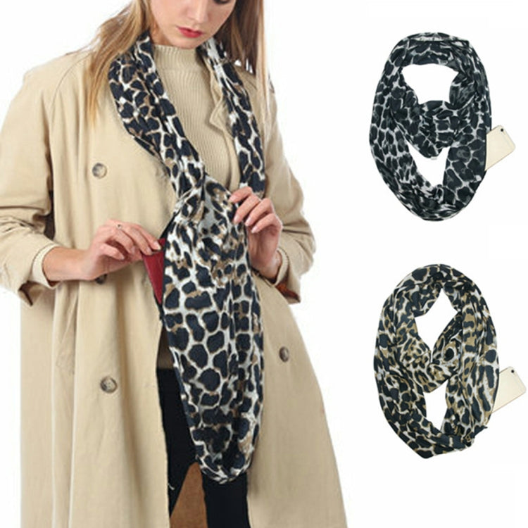 Leopard print infinity scarf, black and tan, worn over a knit top with phone tag