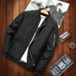 Men's black casual jacket with front zipper, stand collar, and side seam pockets