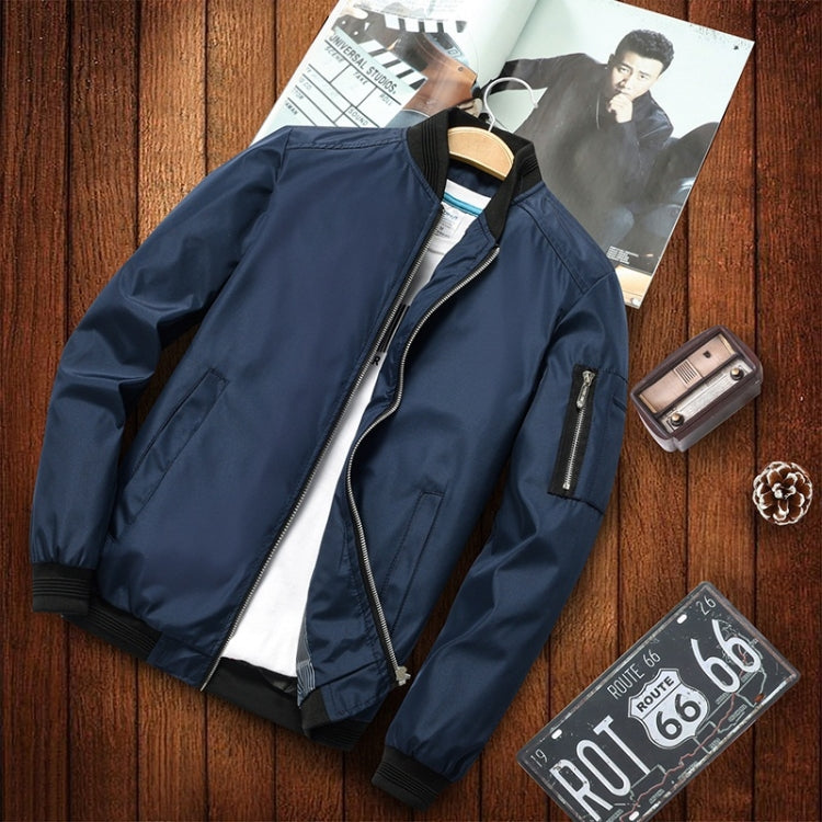 Men's dark blue casual jacket showing zip chest pocket and ribbed cuffs