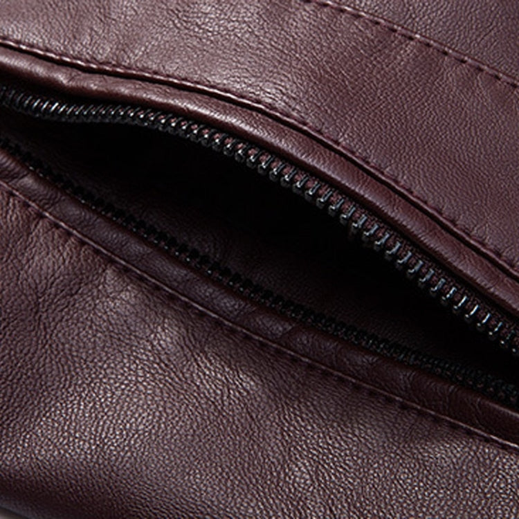 Close-up of maroon PU leather jacket pocket zipper with visible stitching