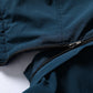 Blue jacket close-up showing zip opening and stitched fabric seams