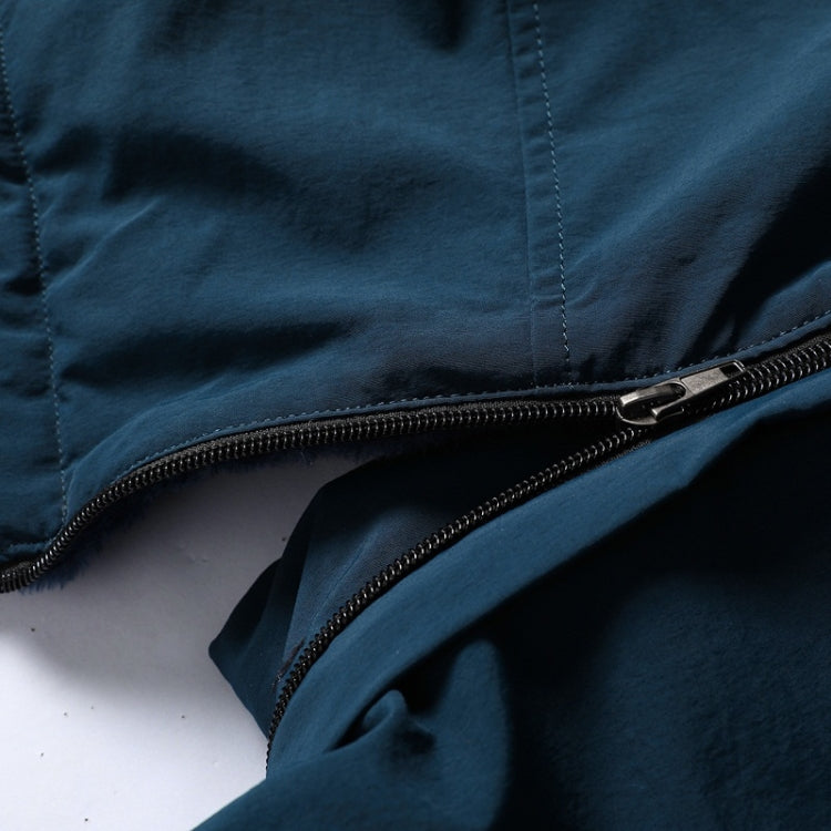 Blue jacket close-up showing zip opening and stitched fabric seams