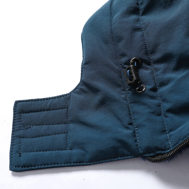 Blue jacket sleeve cuff and hem with snap detail and stitched pocket panel
