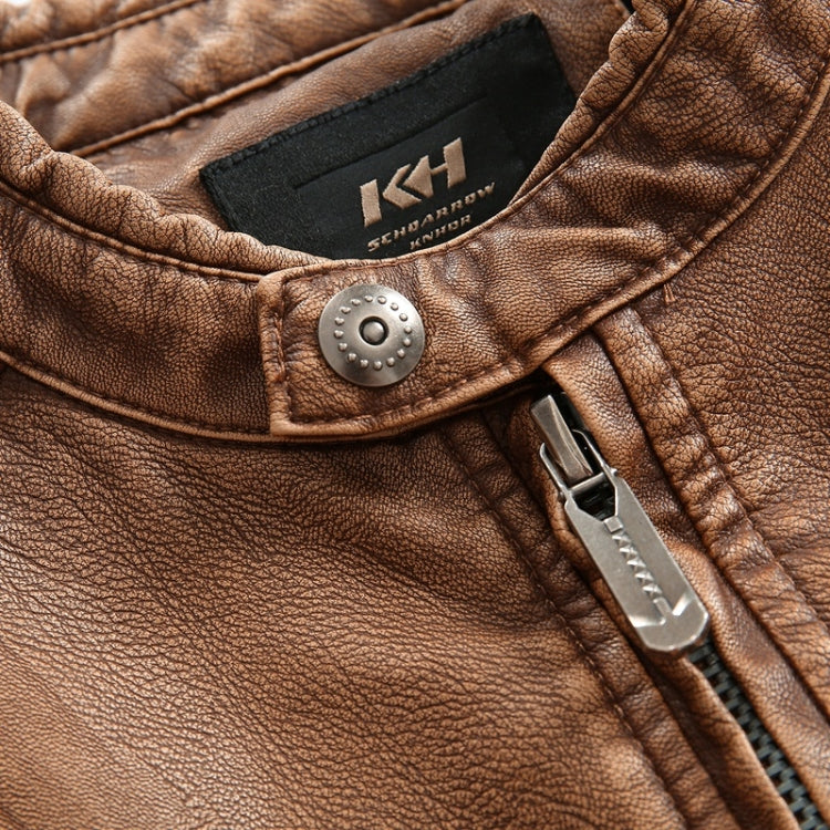 Tan leather jacket close-up of brand badge and snap button detail