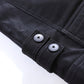 Men's black leather jacket cuff detail with snap buttons and stitched seams