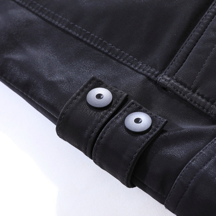 Men's black leather jacket cuff detail with snap buttons and stitched seams