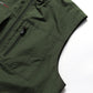 Dark green sleeveless vest chest pocket with zipper and seam stitching close-up