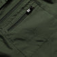 Dark green vest pocket close-up with zipper and brand label