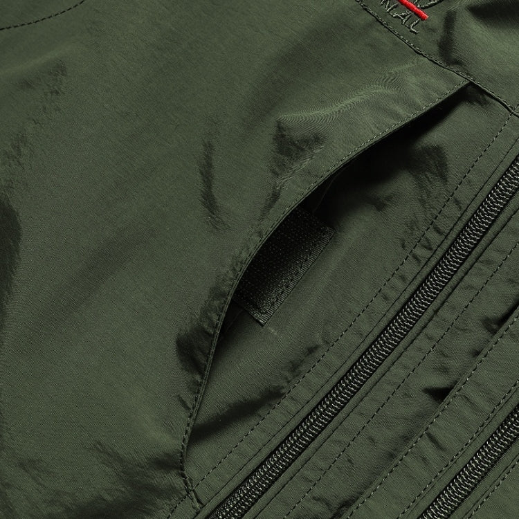 Dark green vest side pocket zipper and seam stitching close-up