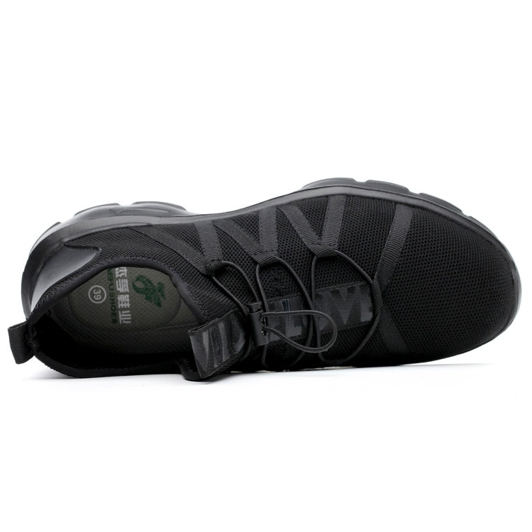 Black safety sneaker showing cushioned insole and textured rubber outsole tread