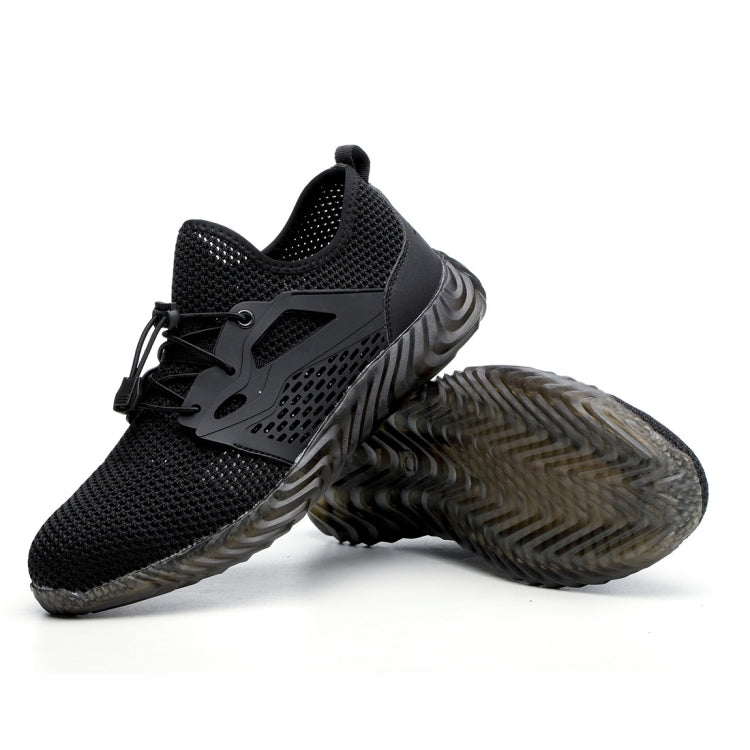 Black work safety shoes showing outsoles with tread pattern and lace-up mesh upper