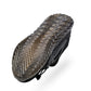 Black work safety shoe outsole with deep tread and textured traction pattern