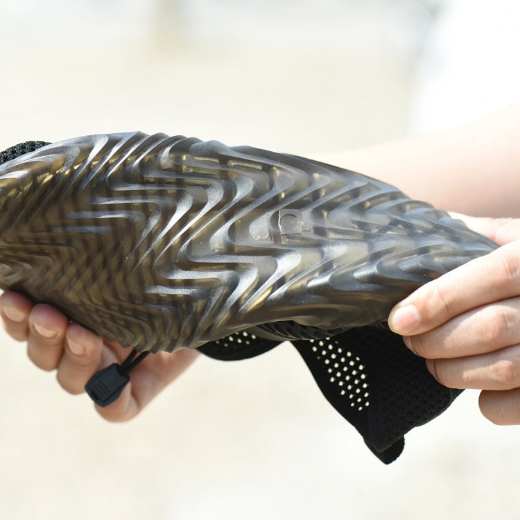 Close-up of black work safety shoe outsole and side mesh with ventilated details