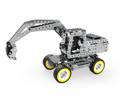 Metallic gray excavator building block kit with articulated boom, bucket, and yellow wheels